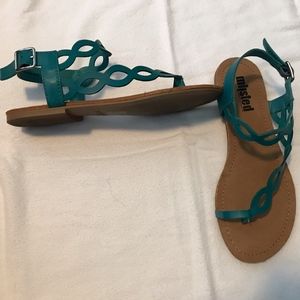 Not your everyday green flat sandal!